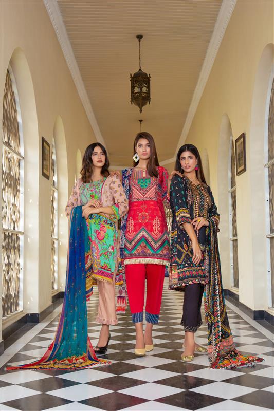Women wearing designer ethnic kurtis in Mumbai corridor.