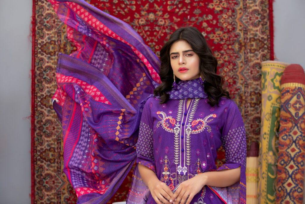 woman wearing a richly embroidered purple kurti