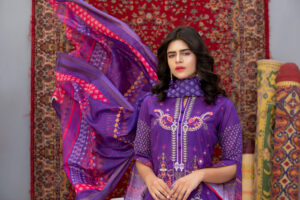woman wearing a richly embroidered purple kurti