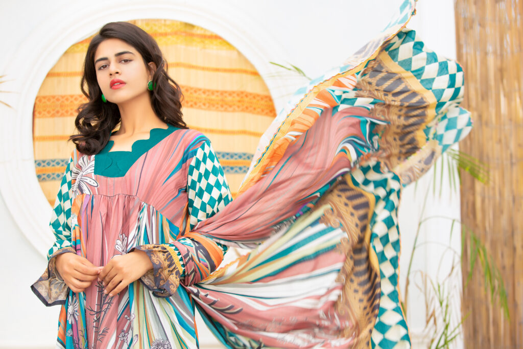 woman wearing a pastel pink and multicolored printed cotton Anarkali